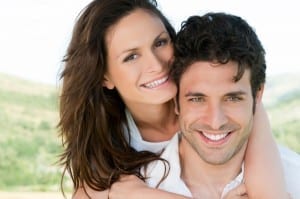 Happy smiling couple enjoy together the summer outdoor